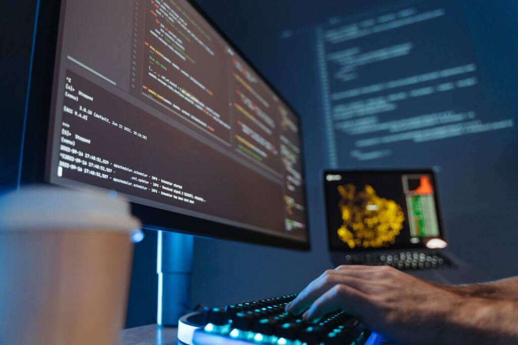 A developer types code on a computer, symbolizing an Android App Development Agency in London.