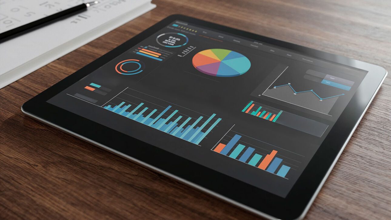 Tablet displaying SEO strategies for businesses in London with colorful graphs and charts on screen.