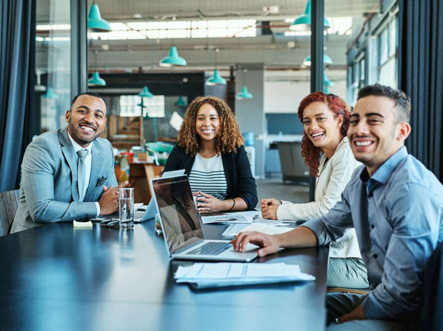 Group meeting discussing AEO and GEO strategies over traditional SEO in a modern office setting.